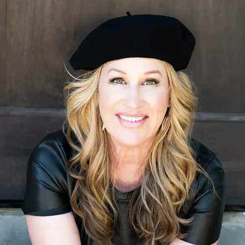 Portrait of Paula Moulton wearing a black beret