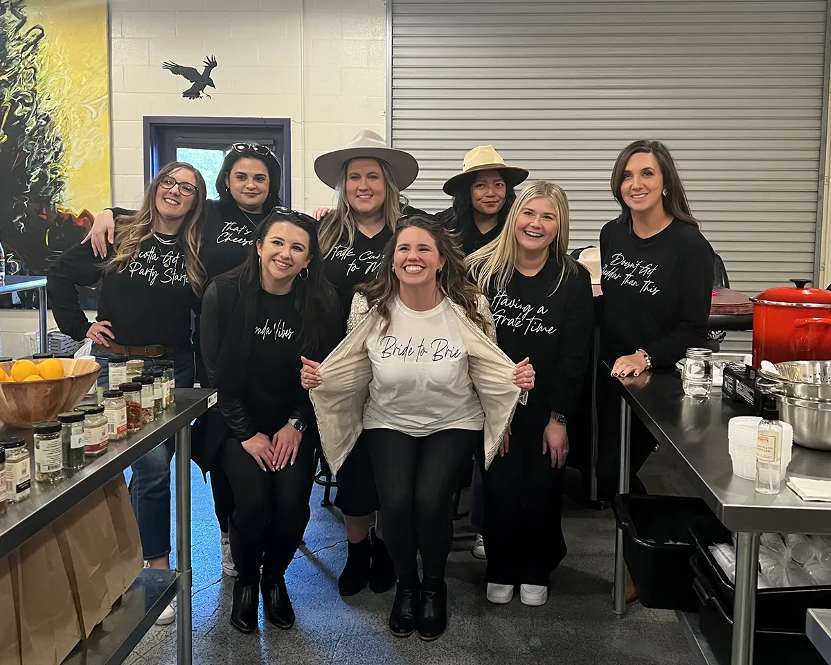 Group of women on a bachelorette party smile for the camera