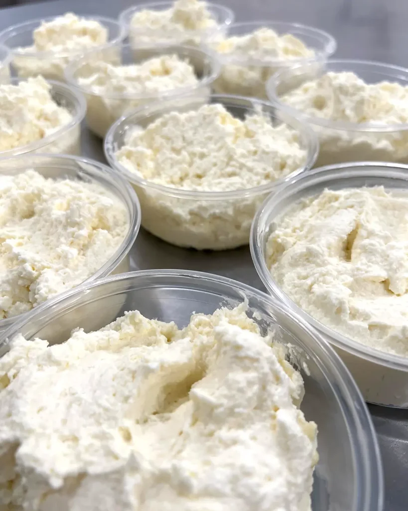 Crème de Fromage packaged into clear half pint containers