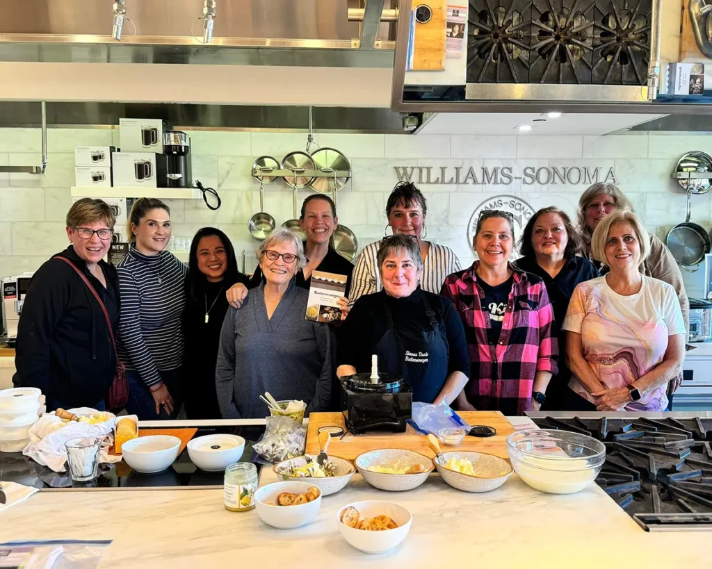 Sheana Davis and a group of students smile for a picture after a cheesemaking class at Williams Sonoma in Sonoma, California